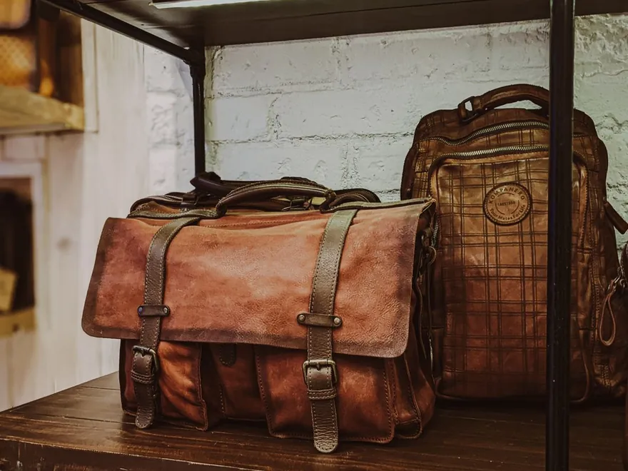 Leather bags displayed on a shelf